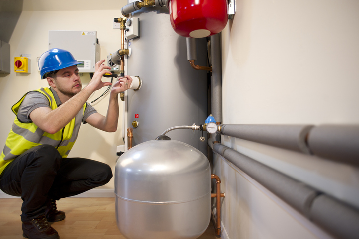 tech installing a furnace