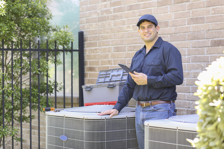 hvac tech by hvac unit